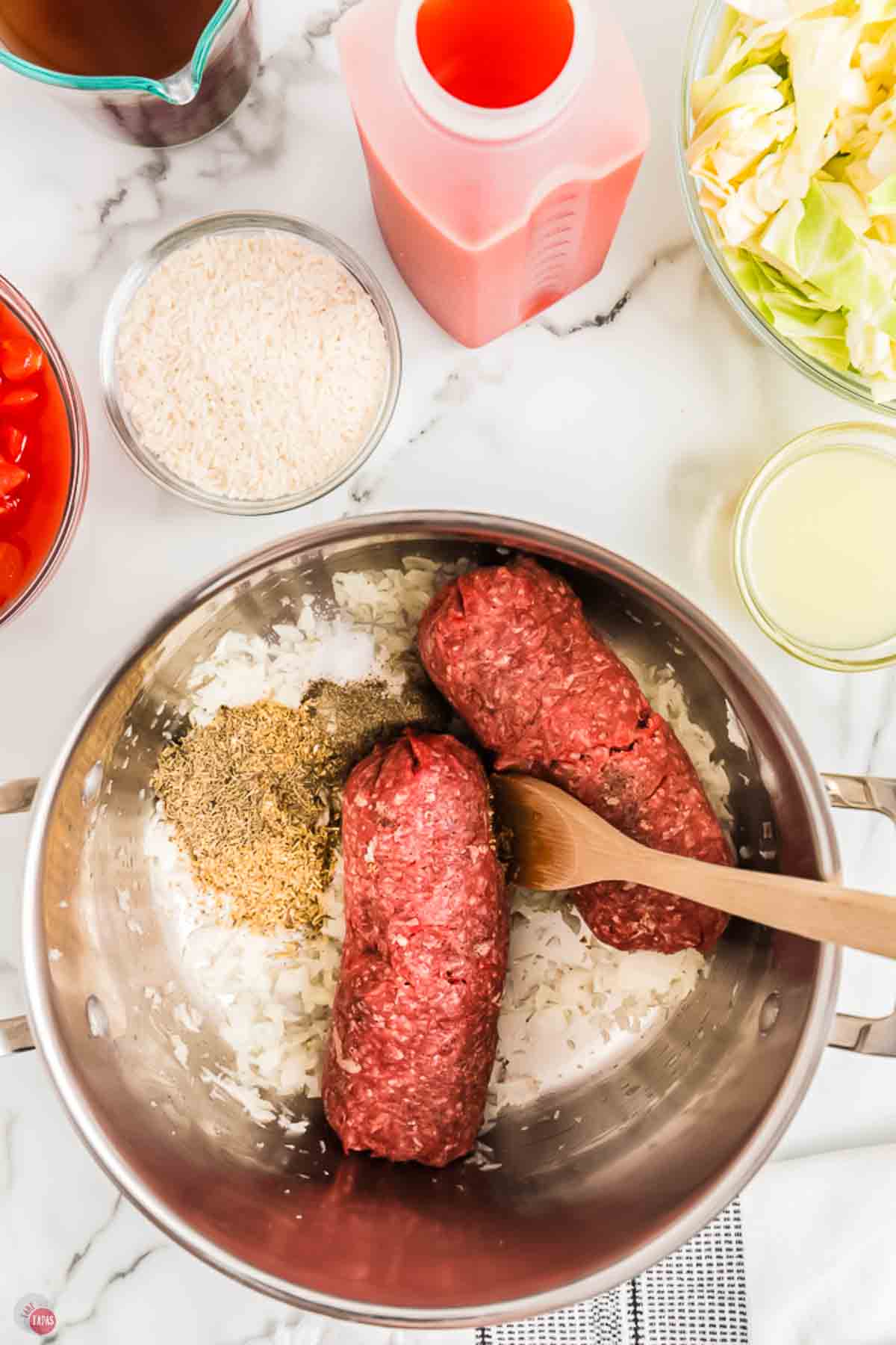 raw ground beef and onions in a large pot