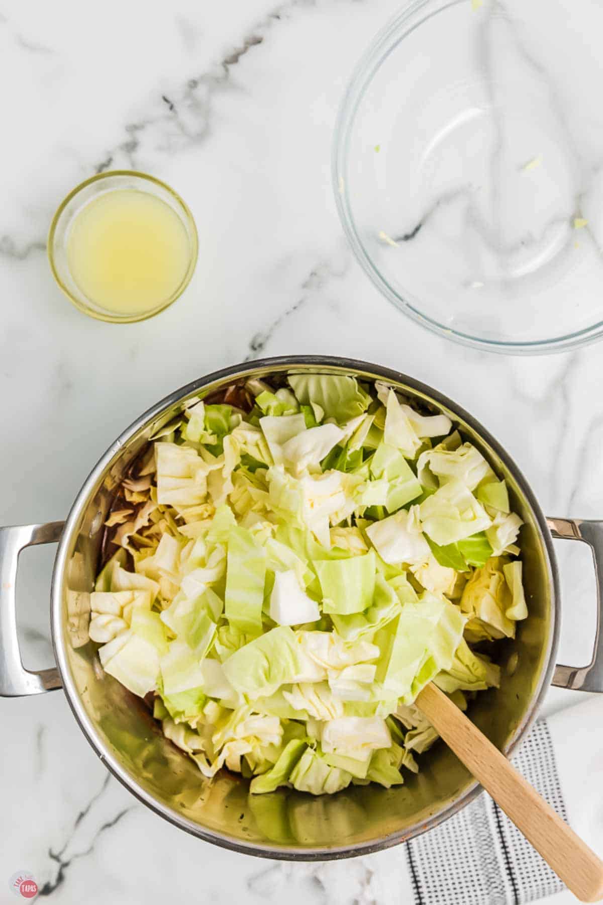 silver pot filled with chopped cabbage