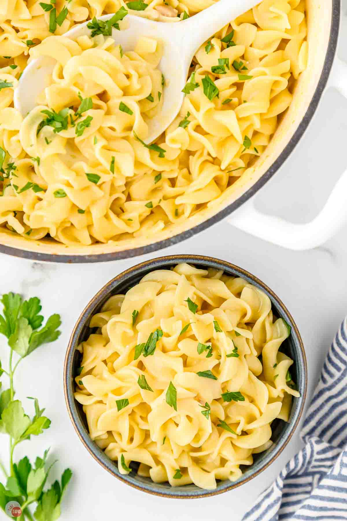 pot and bowl filled with cafeteria noodles