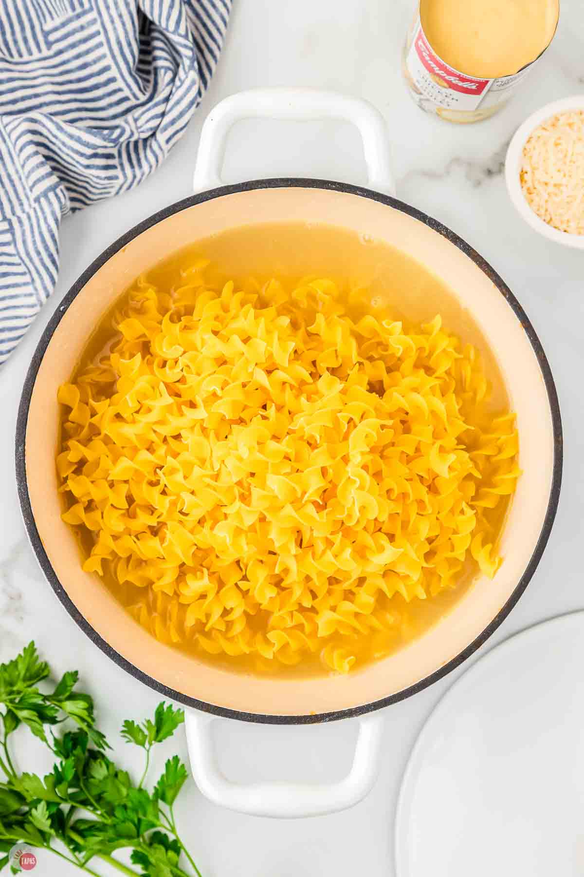 pot of egg noodles in chicken broth