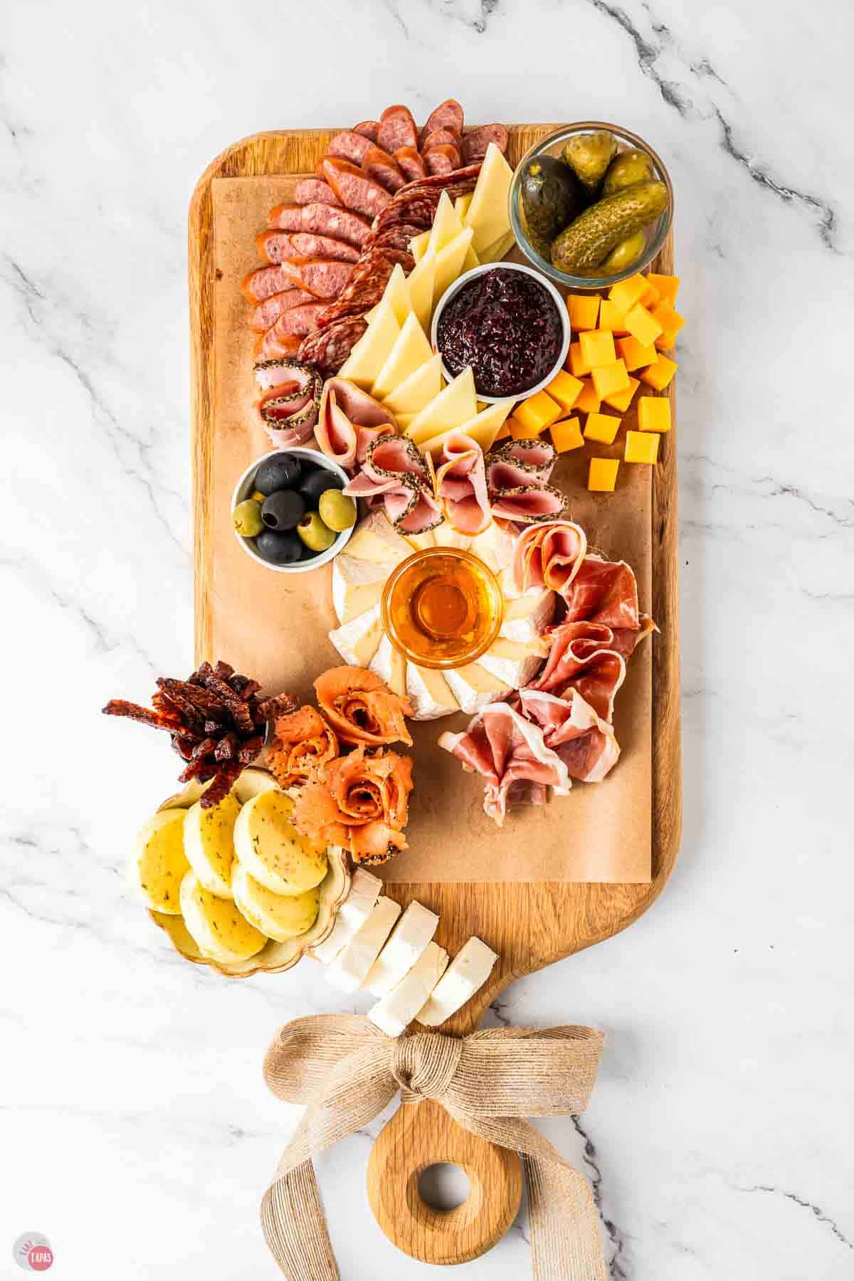 board with cheese and meats added