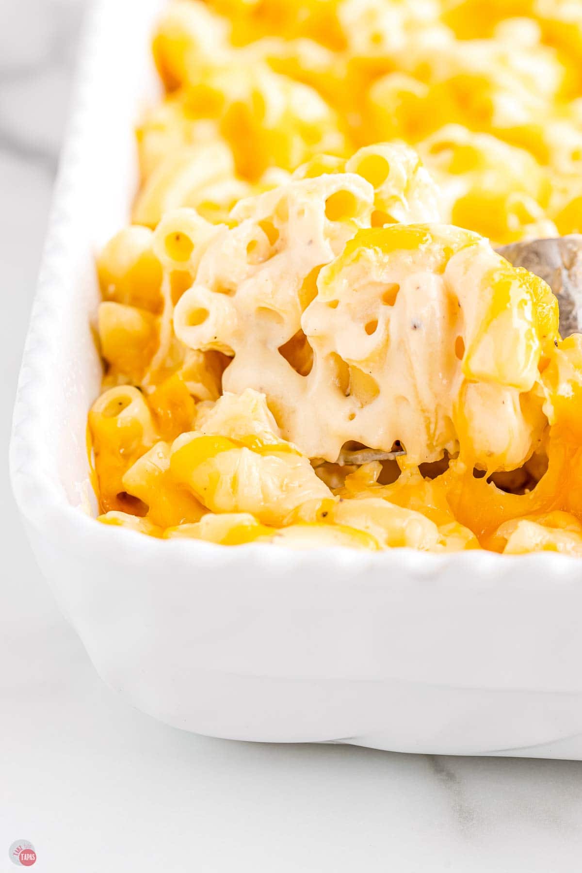 spoon scooping out macaroni and cheese