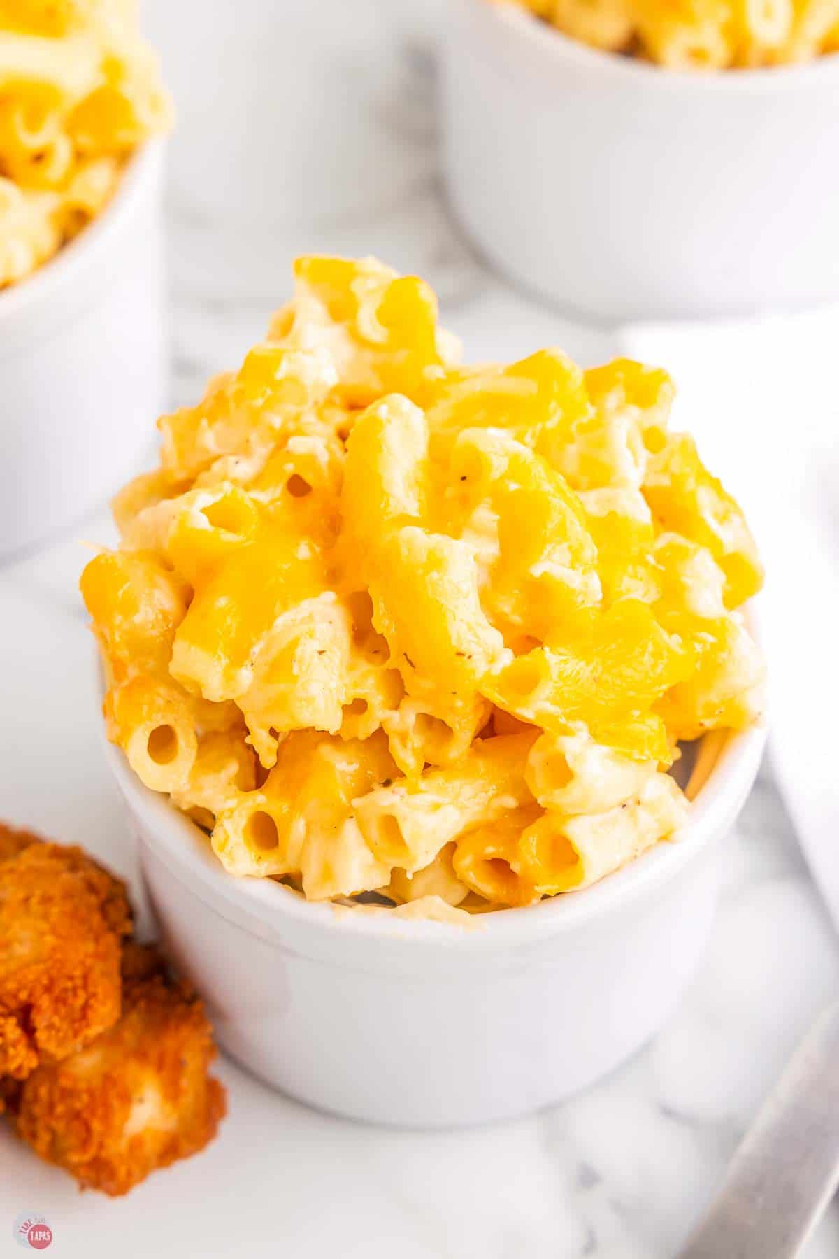 small white ramekin with macaroni and cheese in it