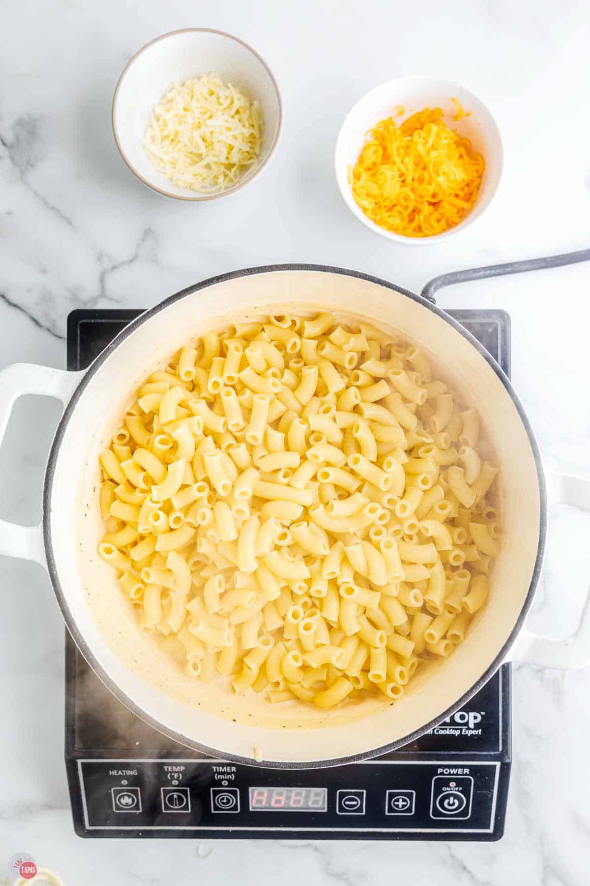 large macaroni noodles in a white pot