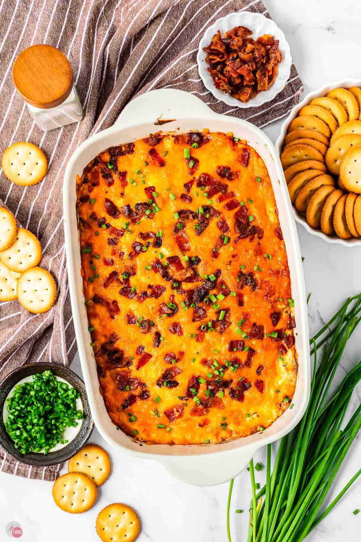 baked chicken bacon ranch dip surrounded by crackers