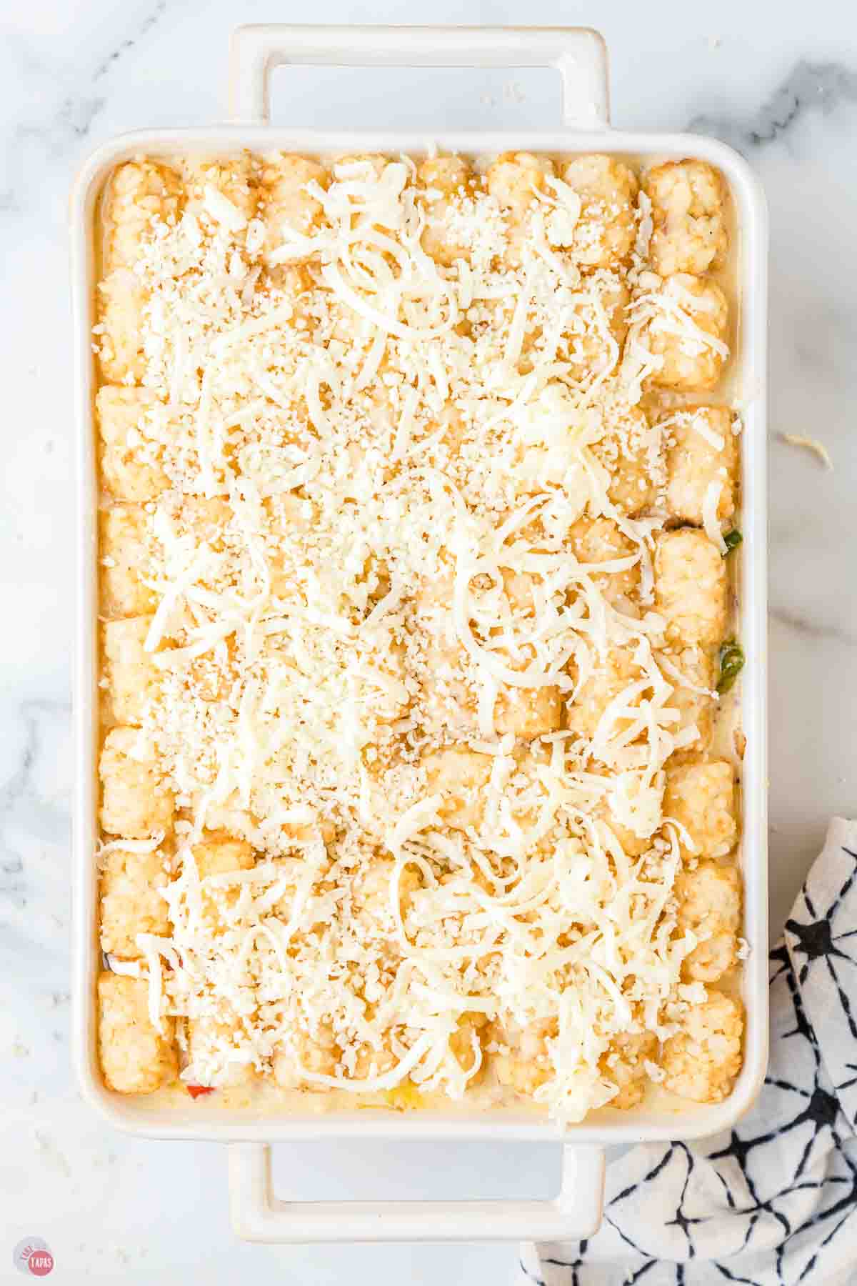 shredded cheese on top of tater tots