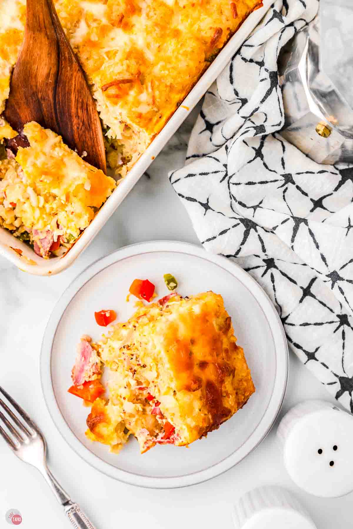 overhead view of baking dish and a small plate with potatoes on it