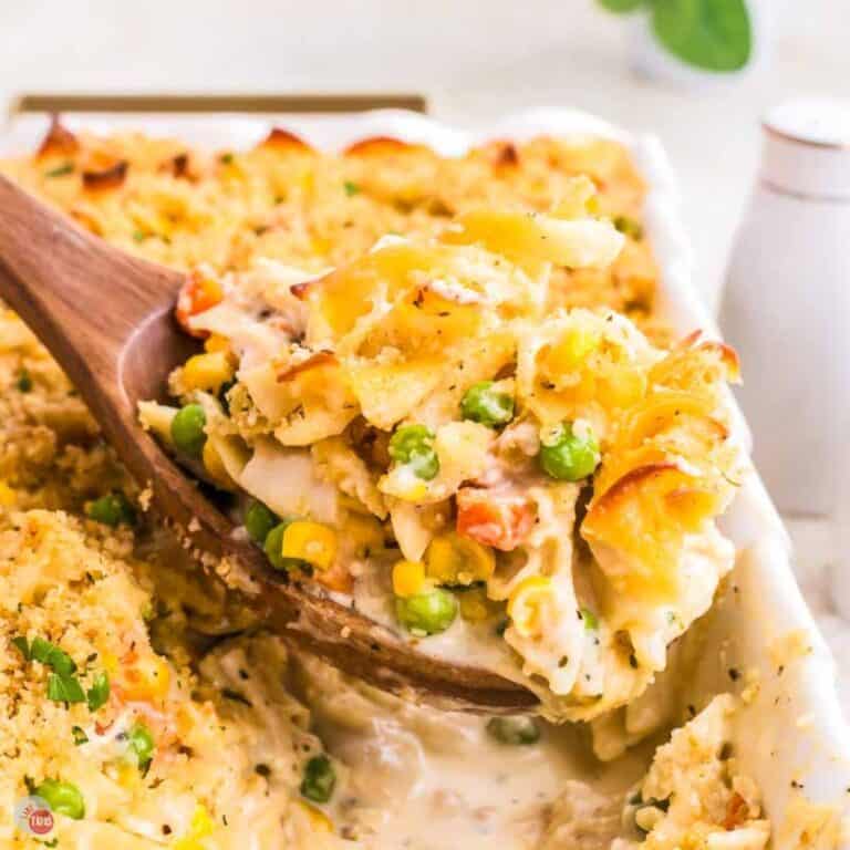 wood spoon with chicken and egg noodles