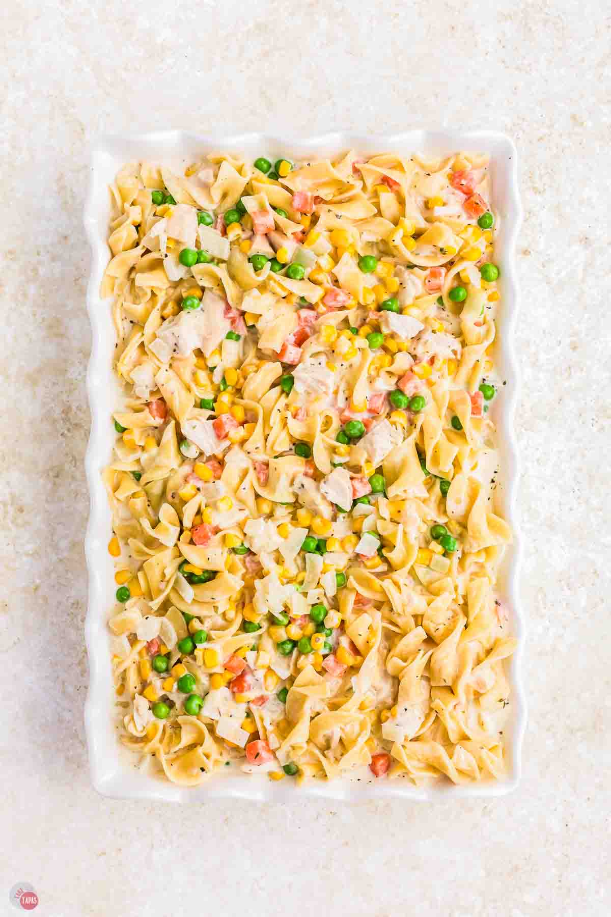 unbaked casserole in a white dish