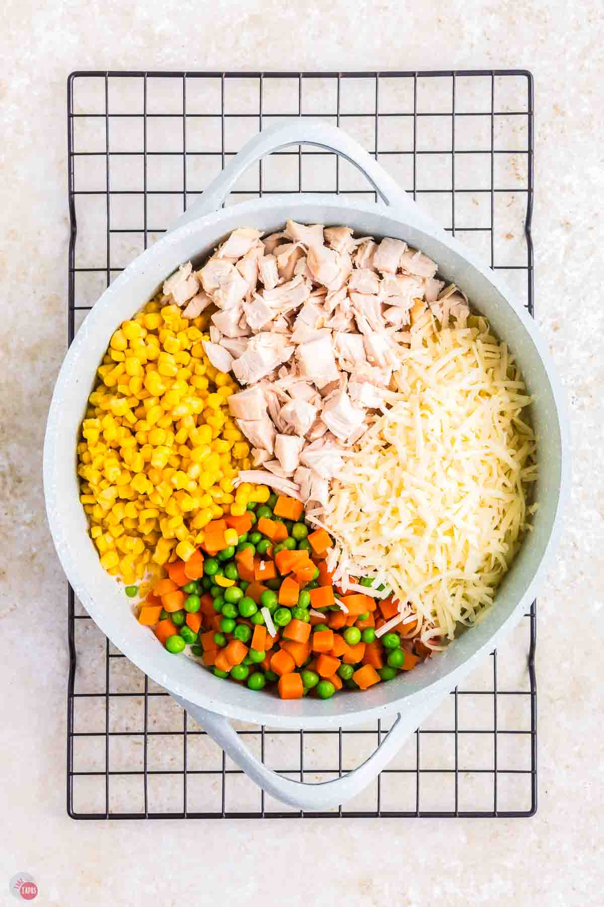 chicken vegetables, and cheese in a bowl