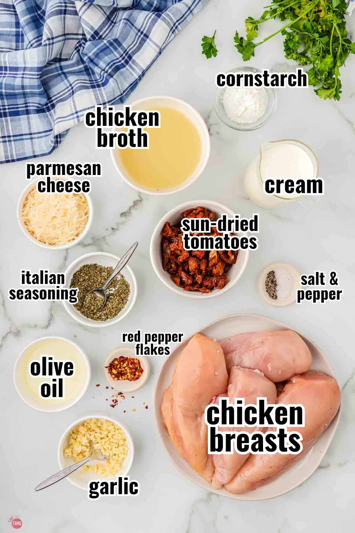 ingredients for a chicken recipe in individual bowls with text overlay labeling them