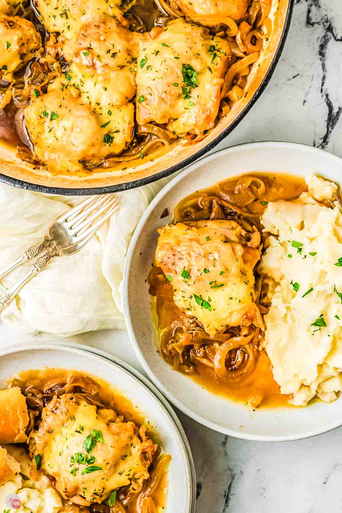 two bowls of mashed potatoes and french onion chicken