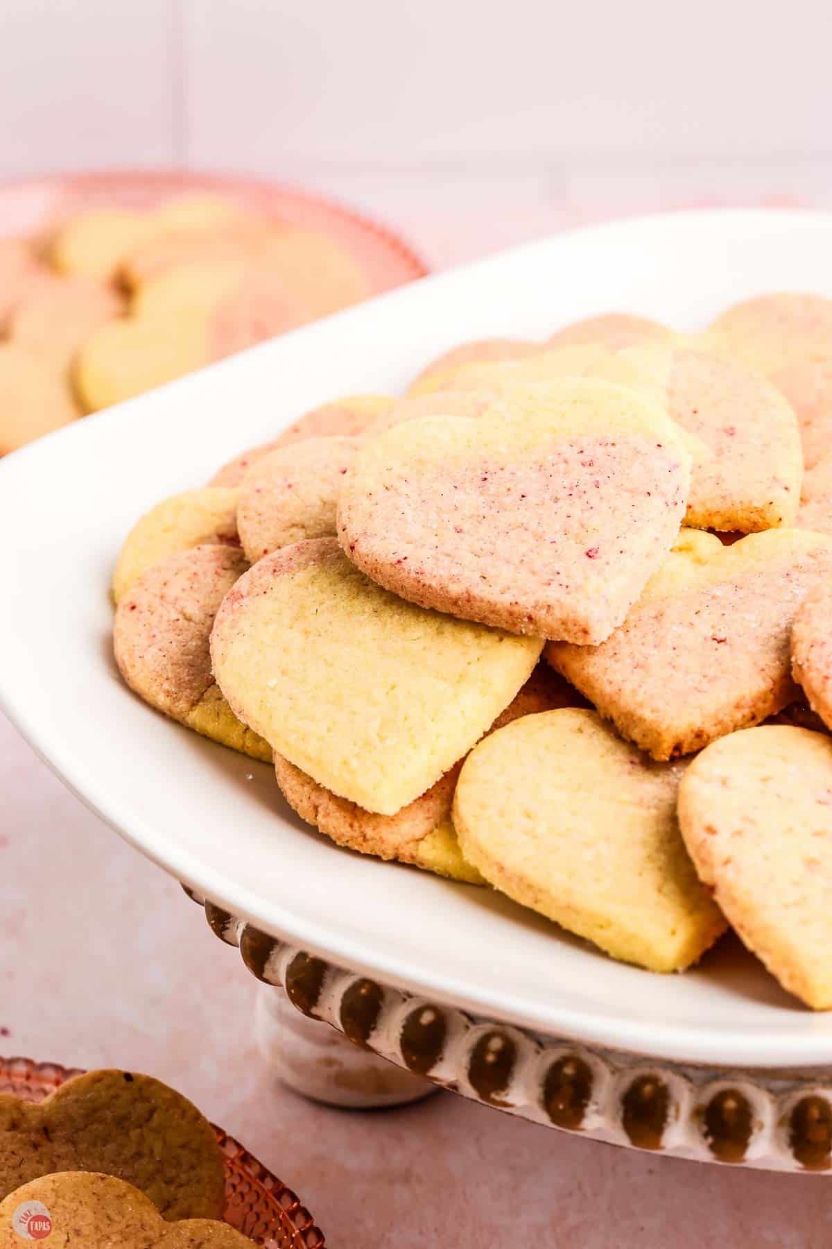 close up picture of sugar cookies on a white platter