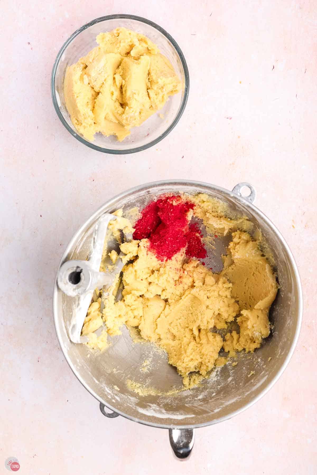 cookie dough in a mixing bowl with red powder
