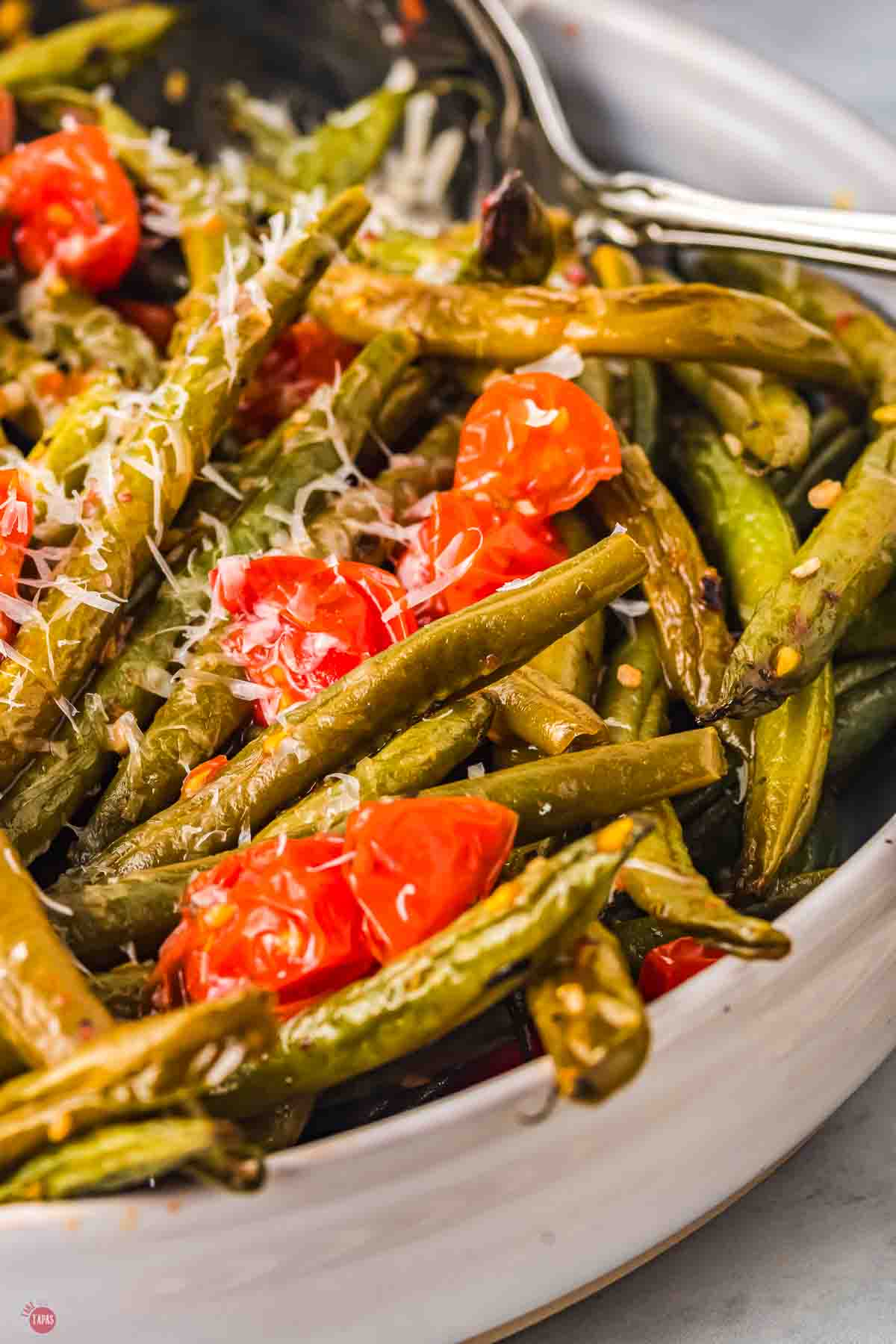 close up of green beans and tomatoes