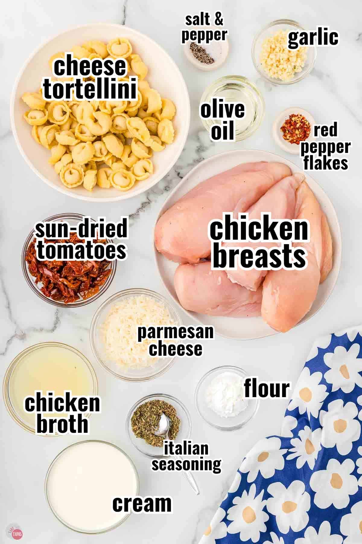 ingredients for a chicken recipe in individual bowl with text overlay labeling them