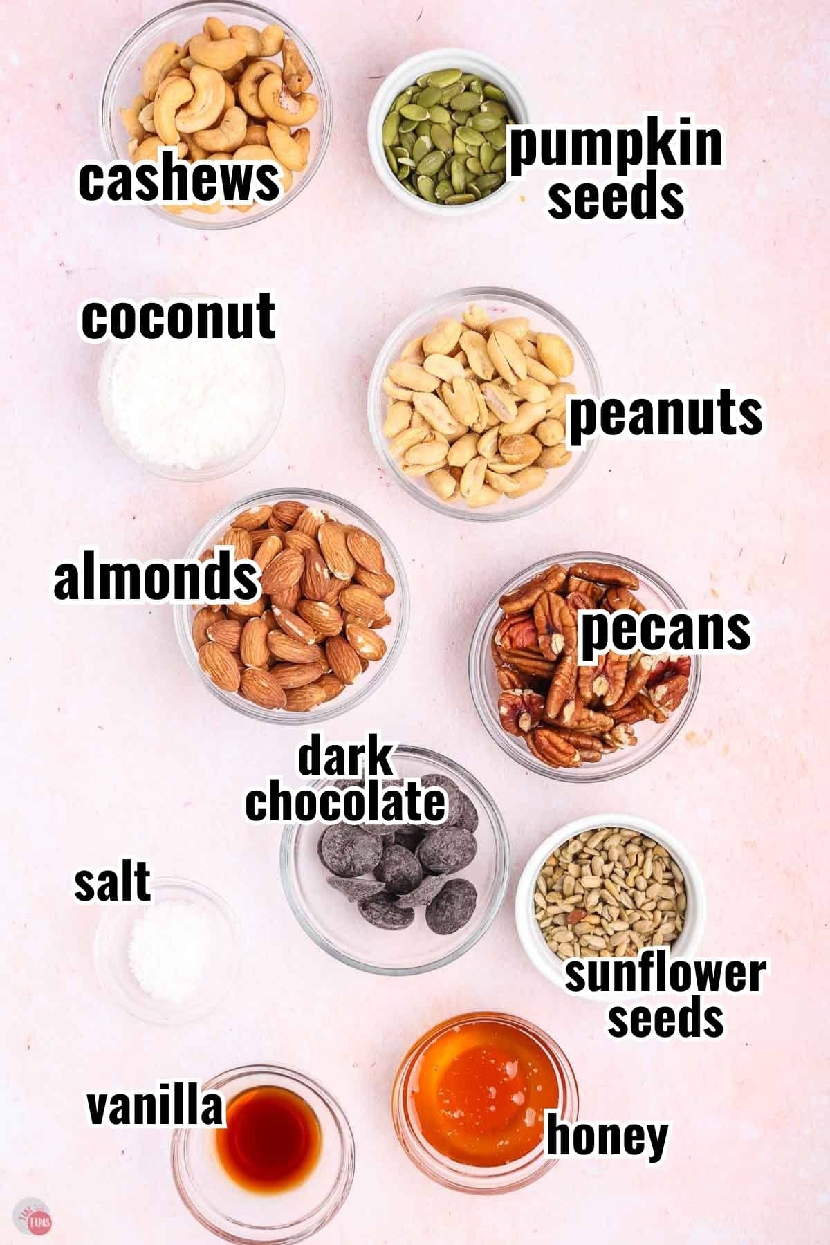 ingredients for nut clusters in individual bowls with text overlay labeling thing