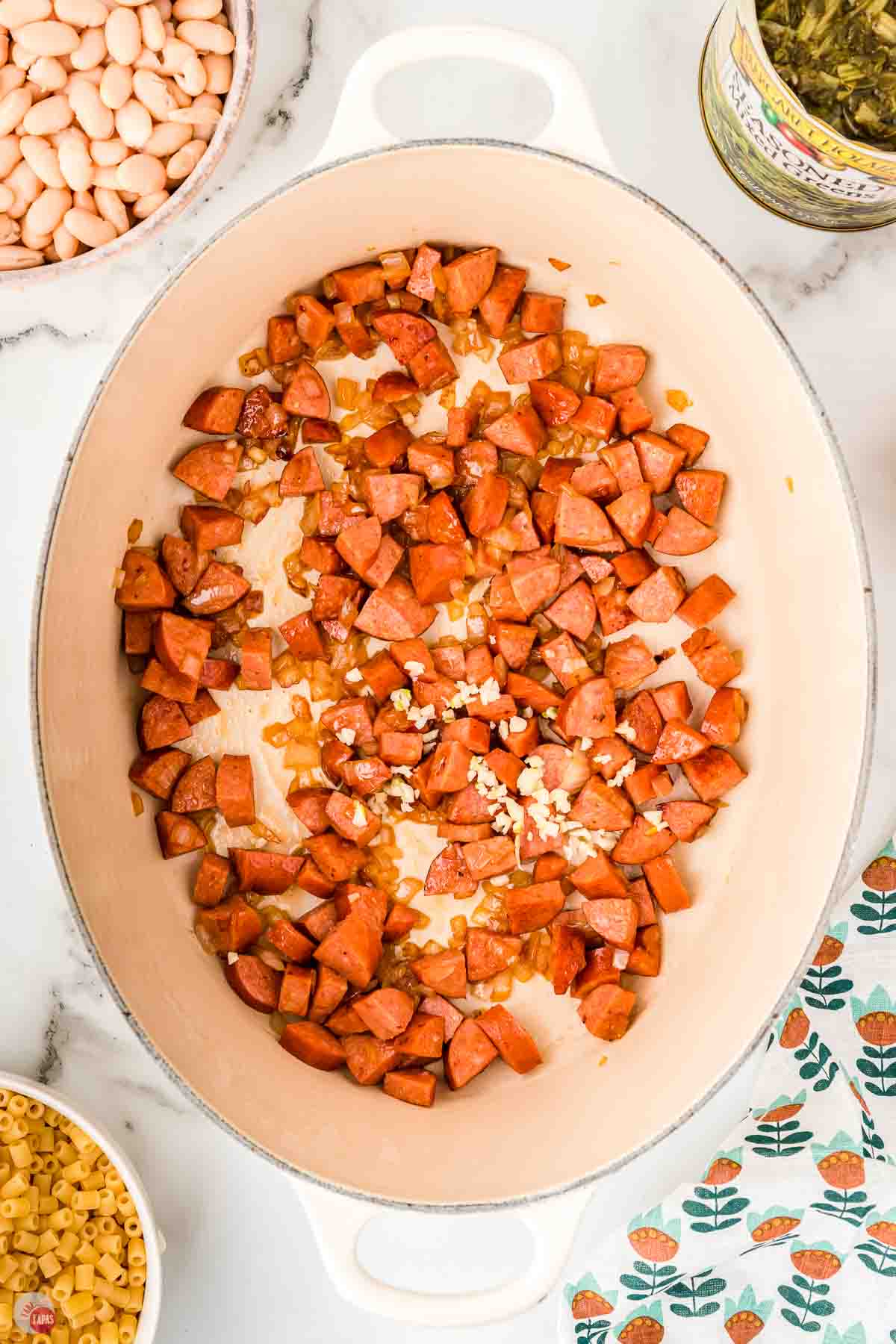 chopped smoked sausage cooking in a large pot