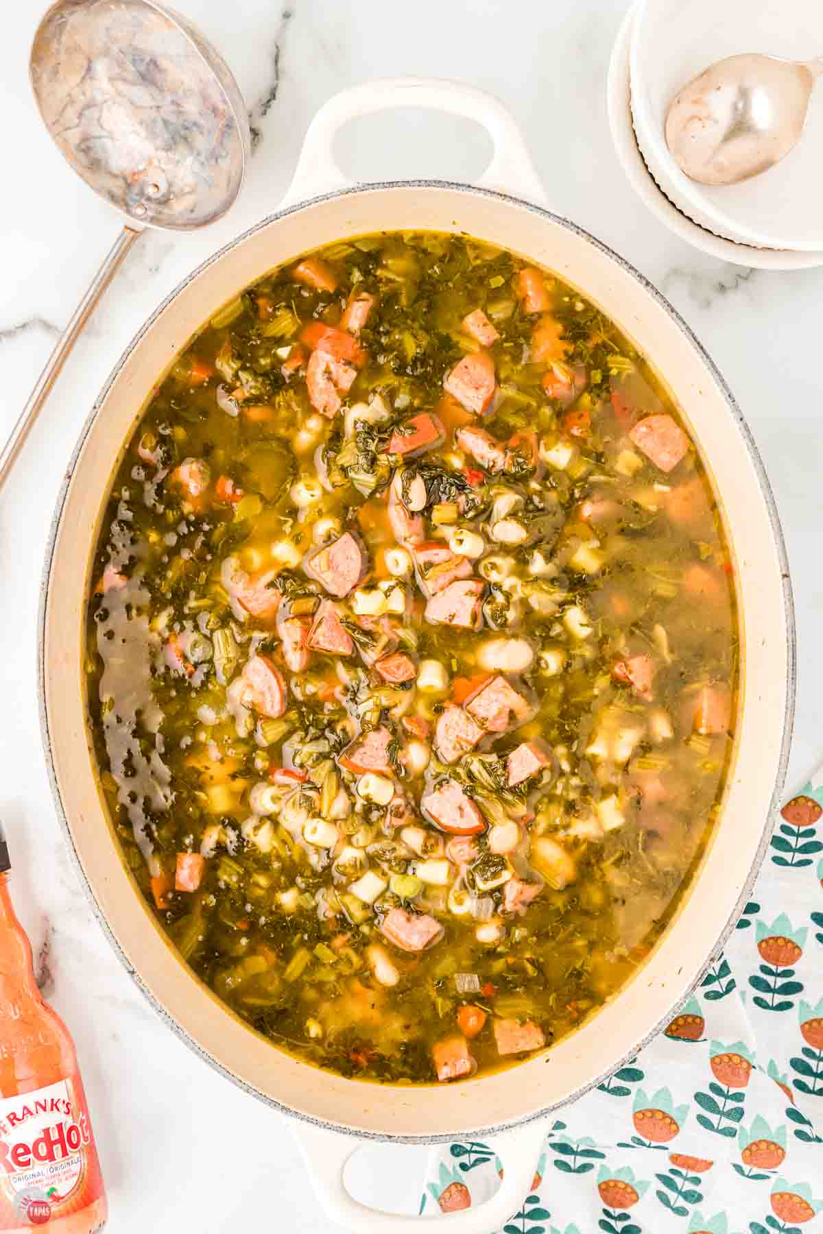 pot of soup with collard greens and beans
