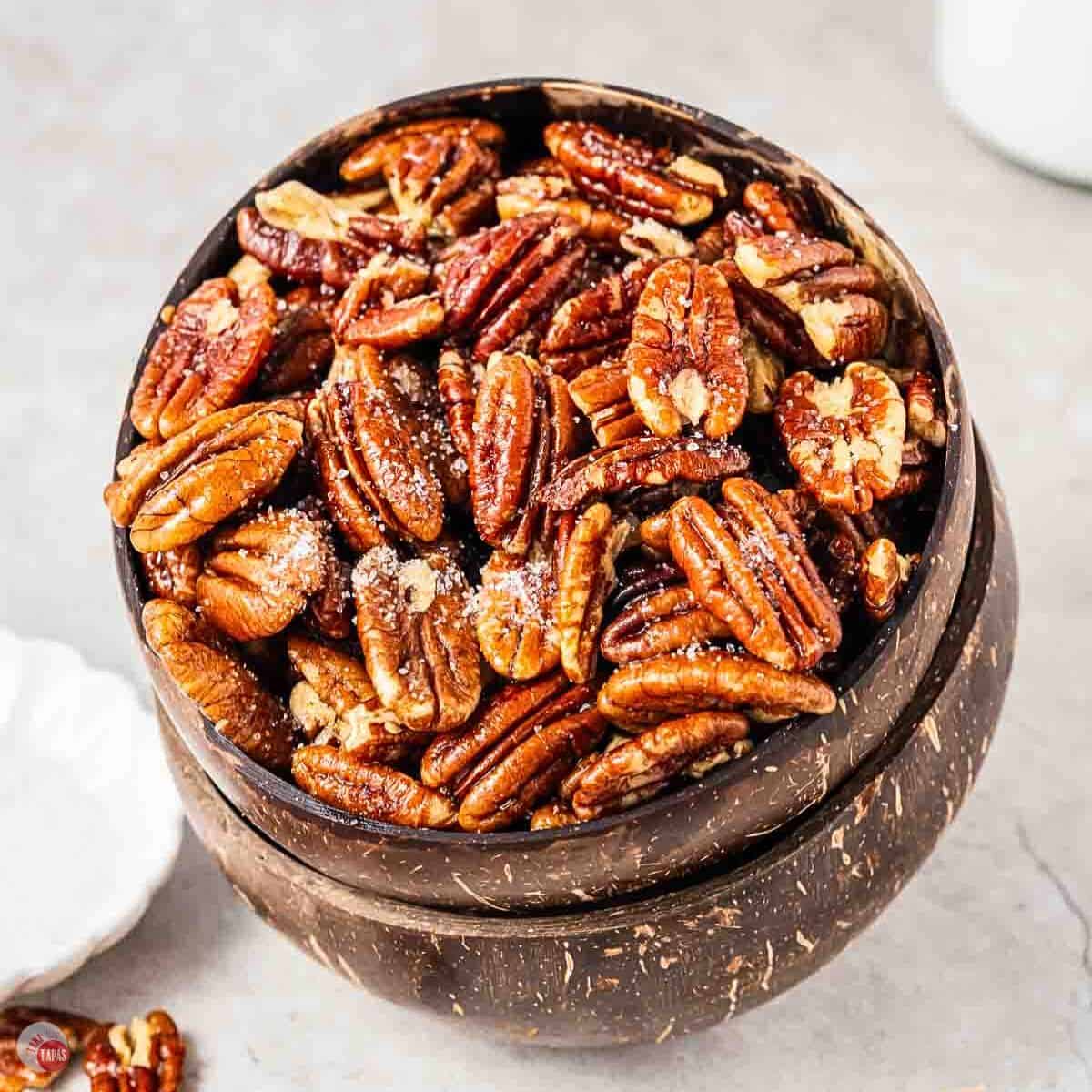 stack of two bowls filled with pecans