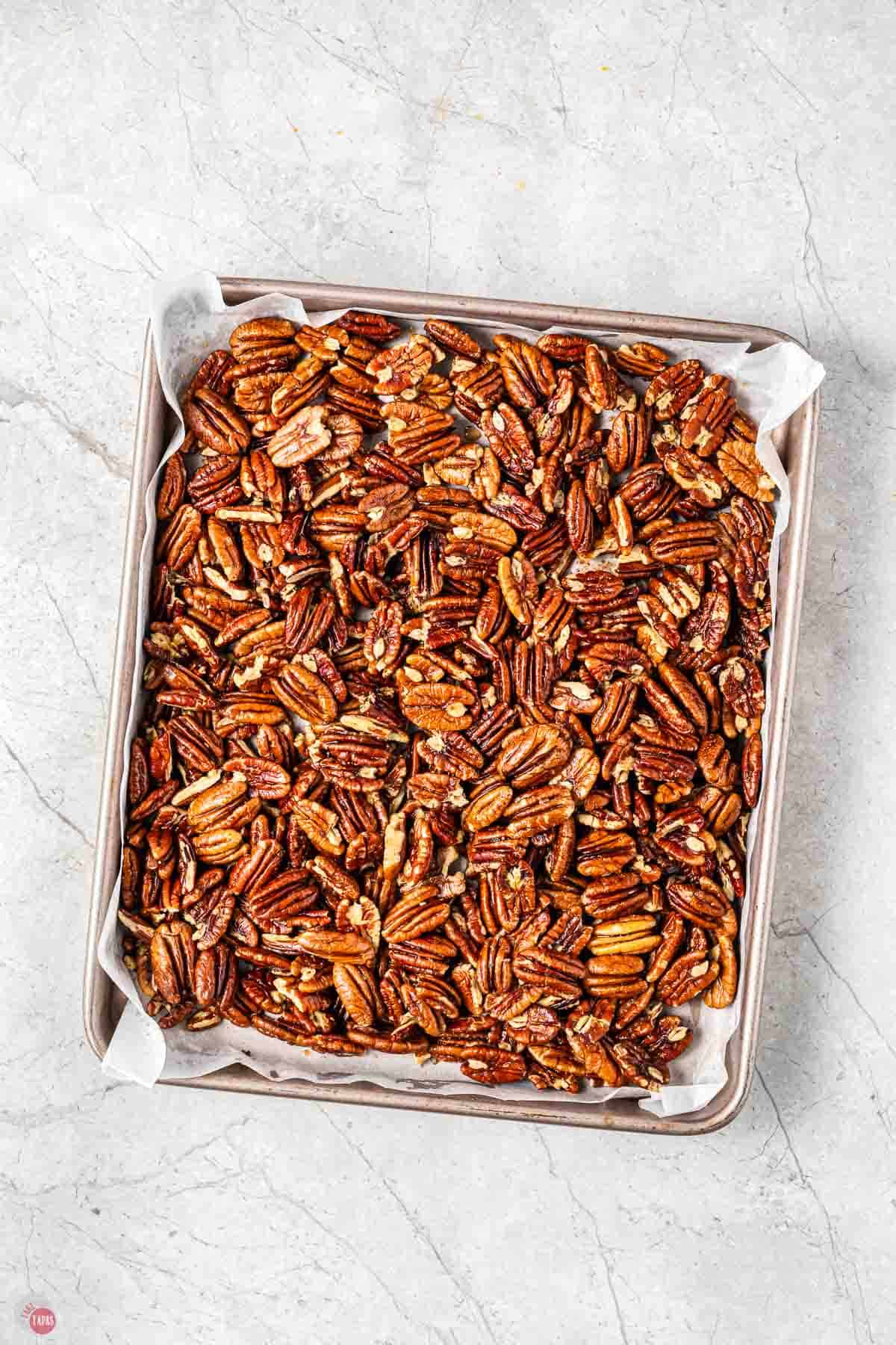 pecans on a baking sheet