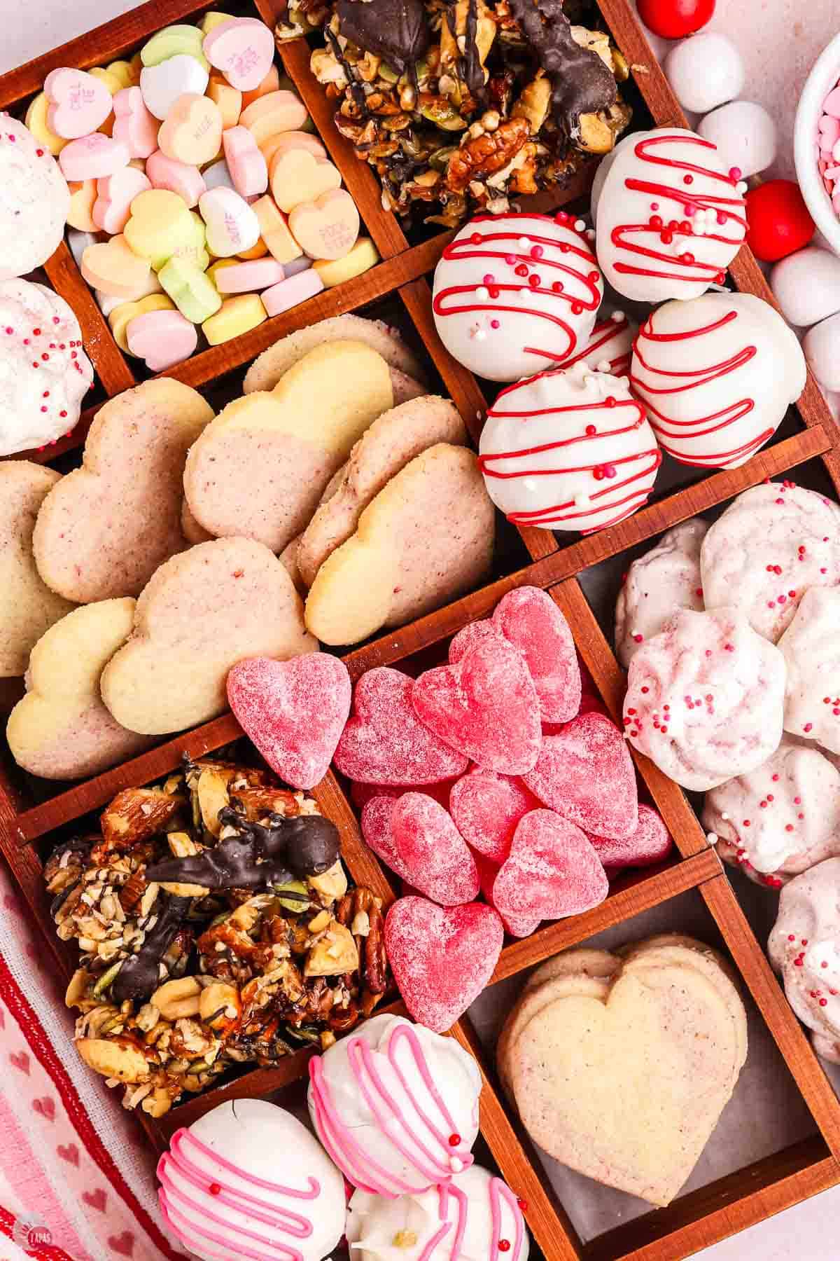 close up of heart shaped candies and cookies