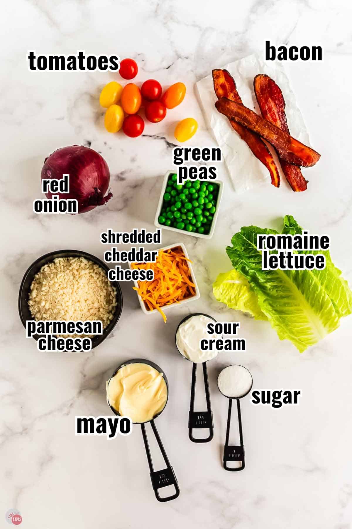 individual ingredients for a salad recipe with text overlay labeling them