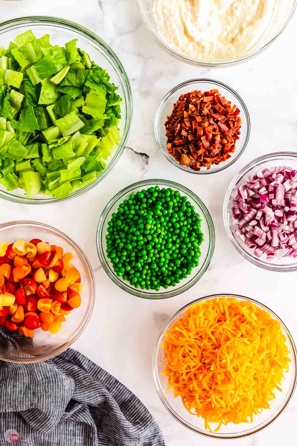individual bowls of chopped vegetables