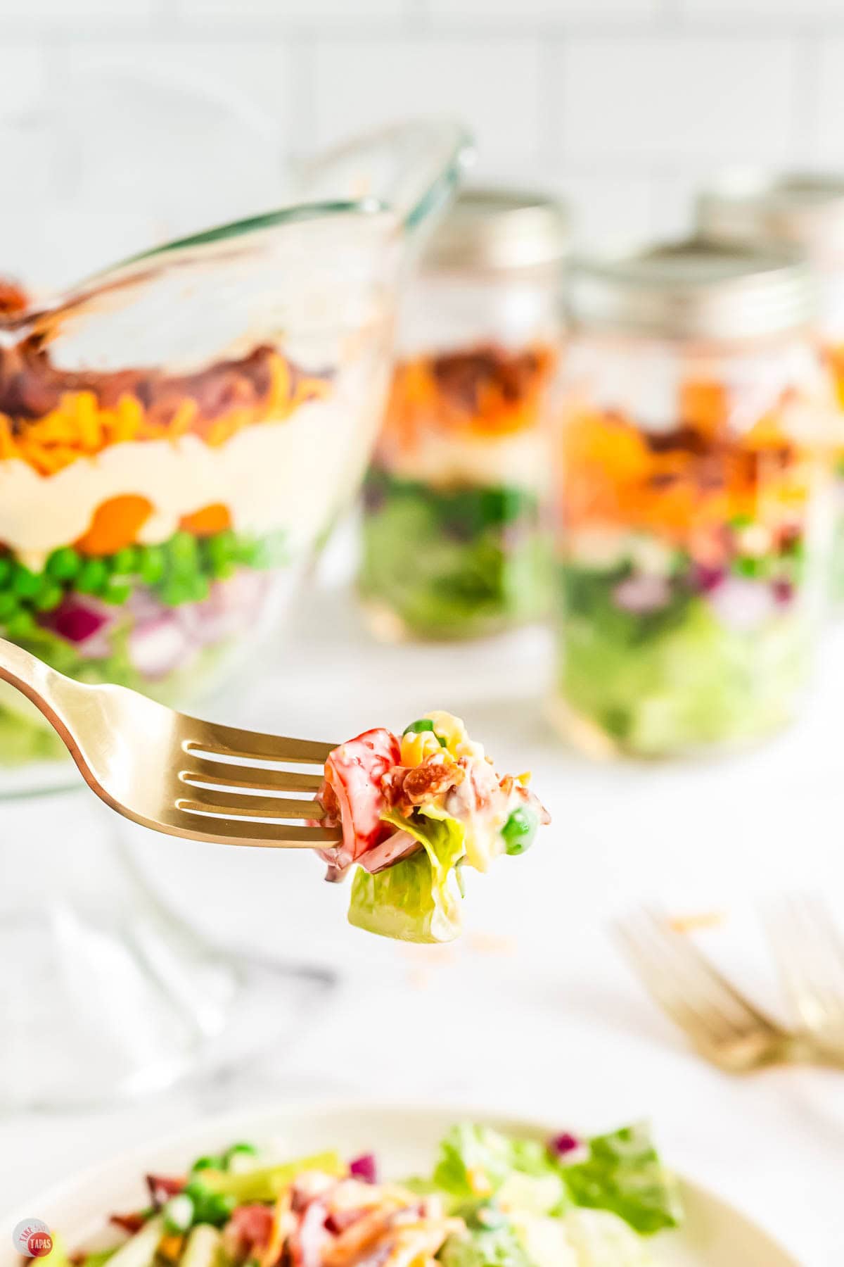 fork with bite of salad on it