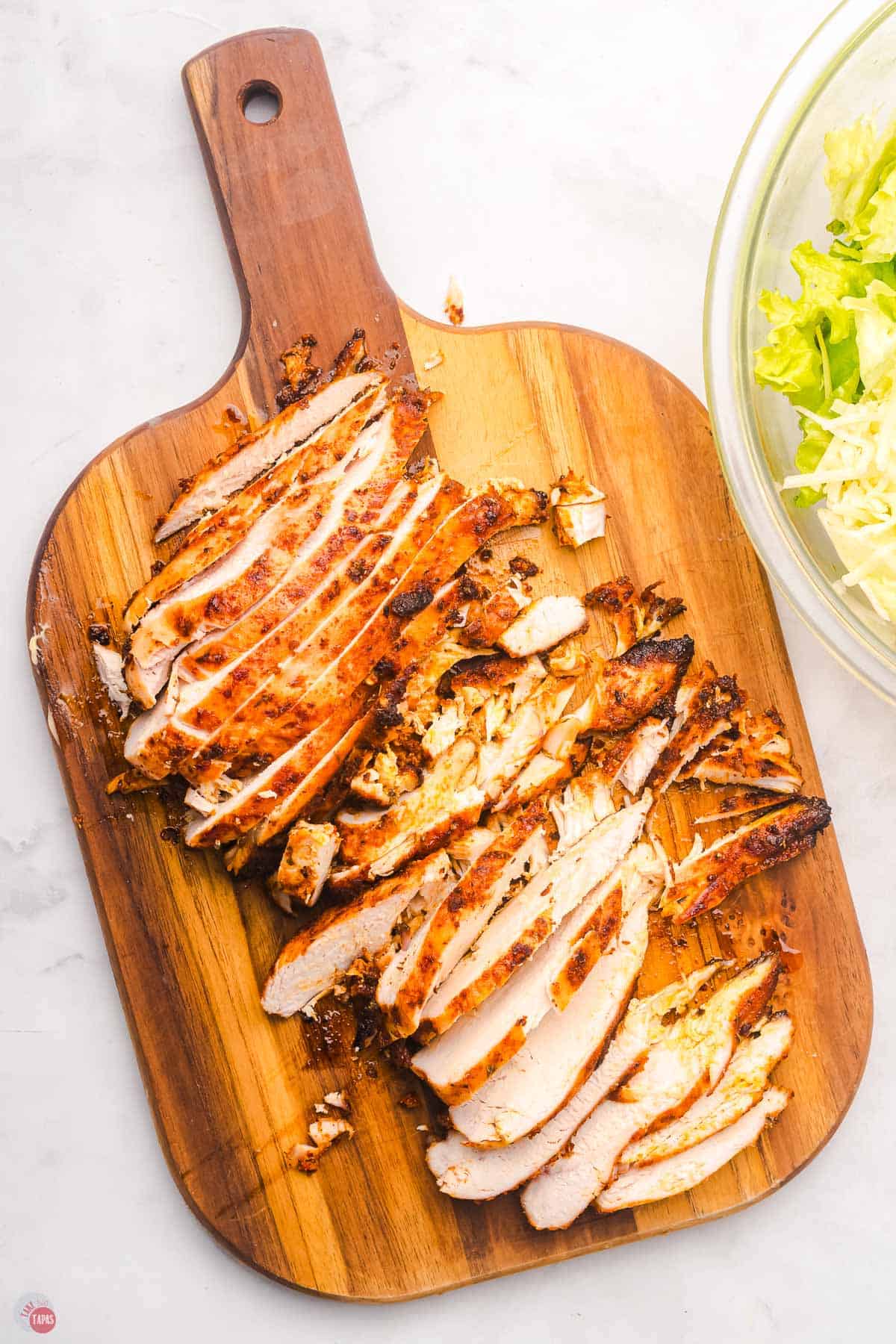 chicken sliced on a cutting board