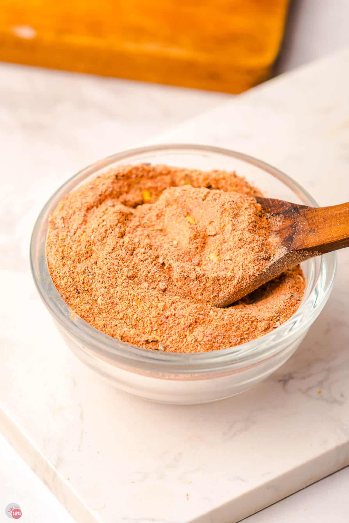 bowl of spice mix with wood spoon