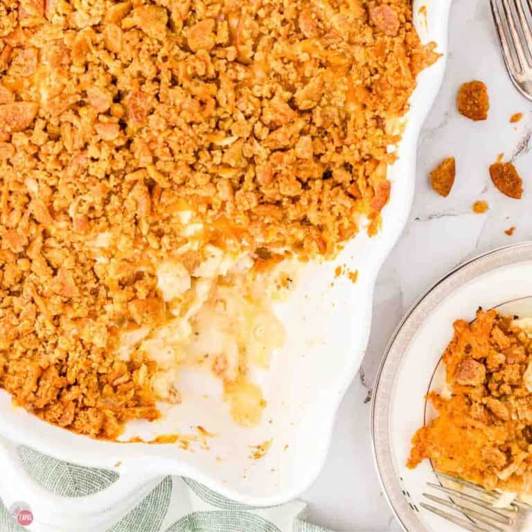 casserole in a white dish with a scoop missing