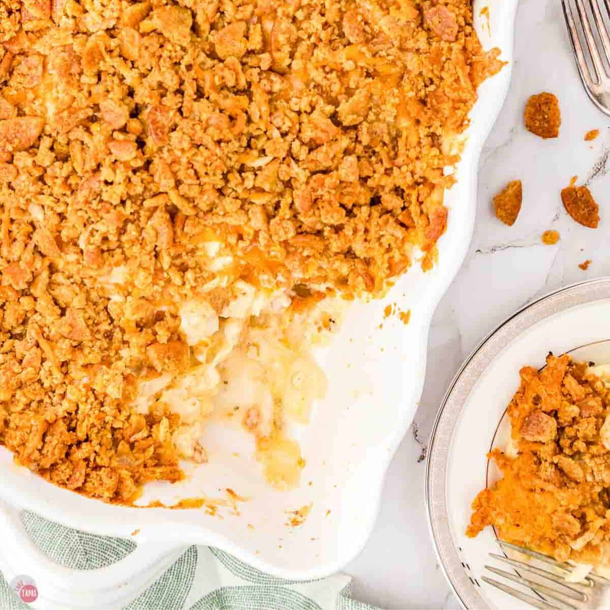 casserole in a white dish with a scoop missing