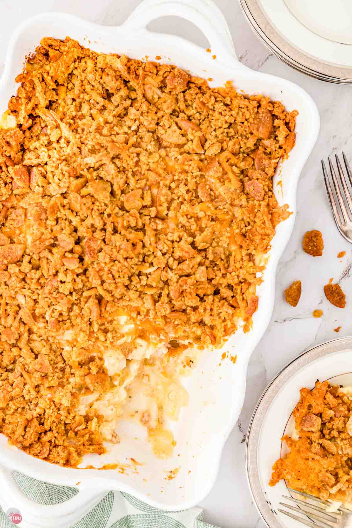 overhead of casserole in a white dish topped with cracker crumbs