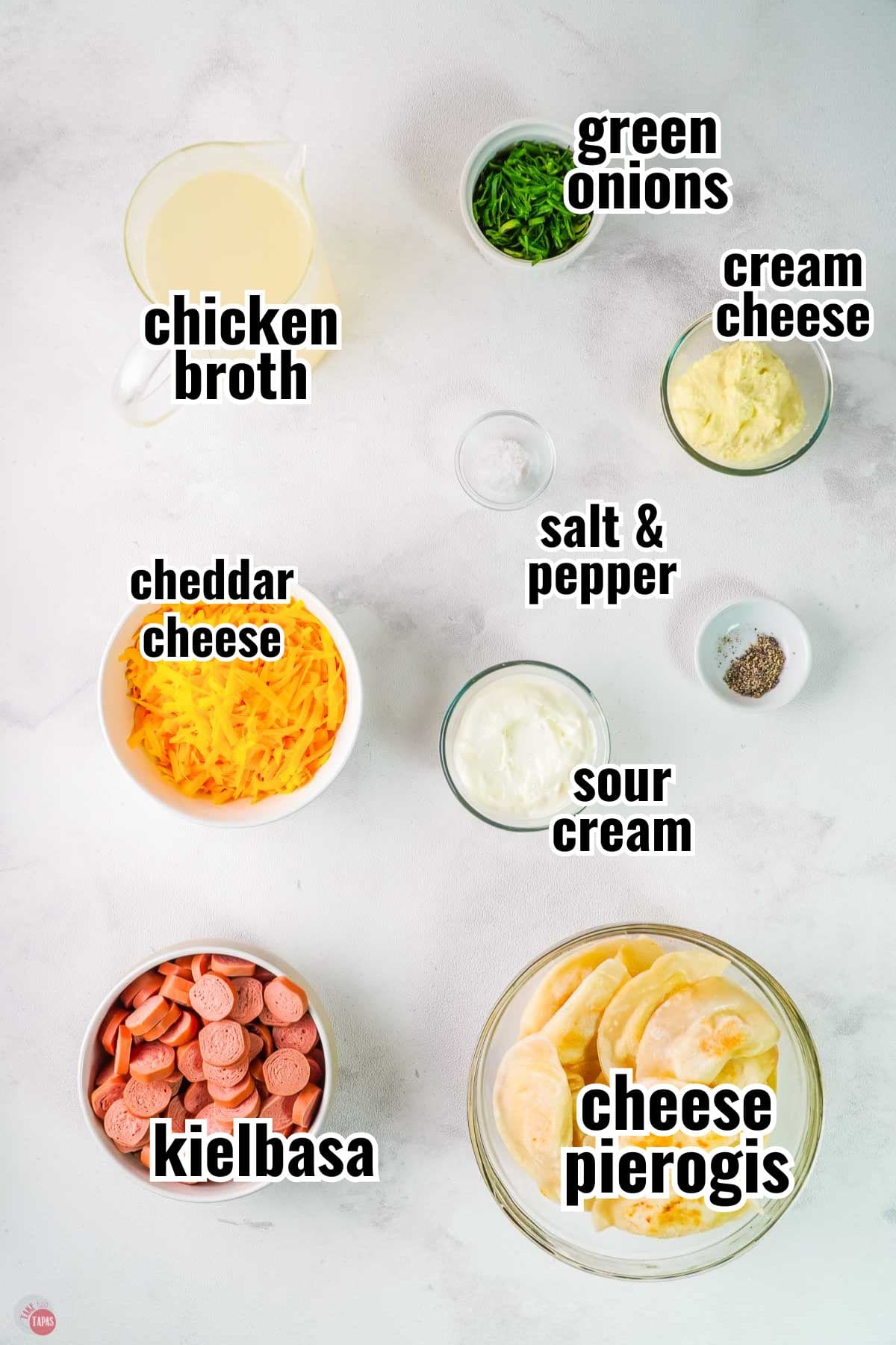 ingredients for a casserole recipe in individual bowls with text overlay labeling them