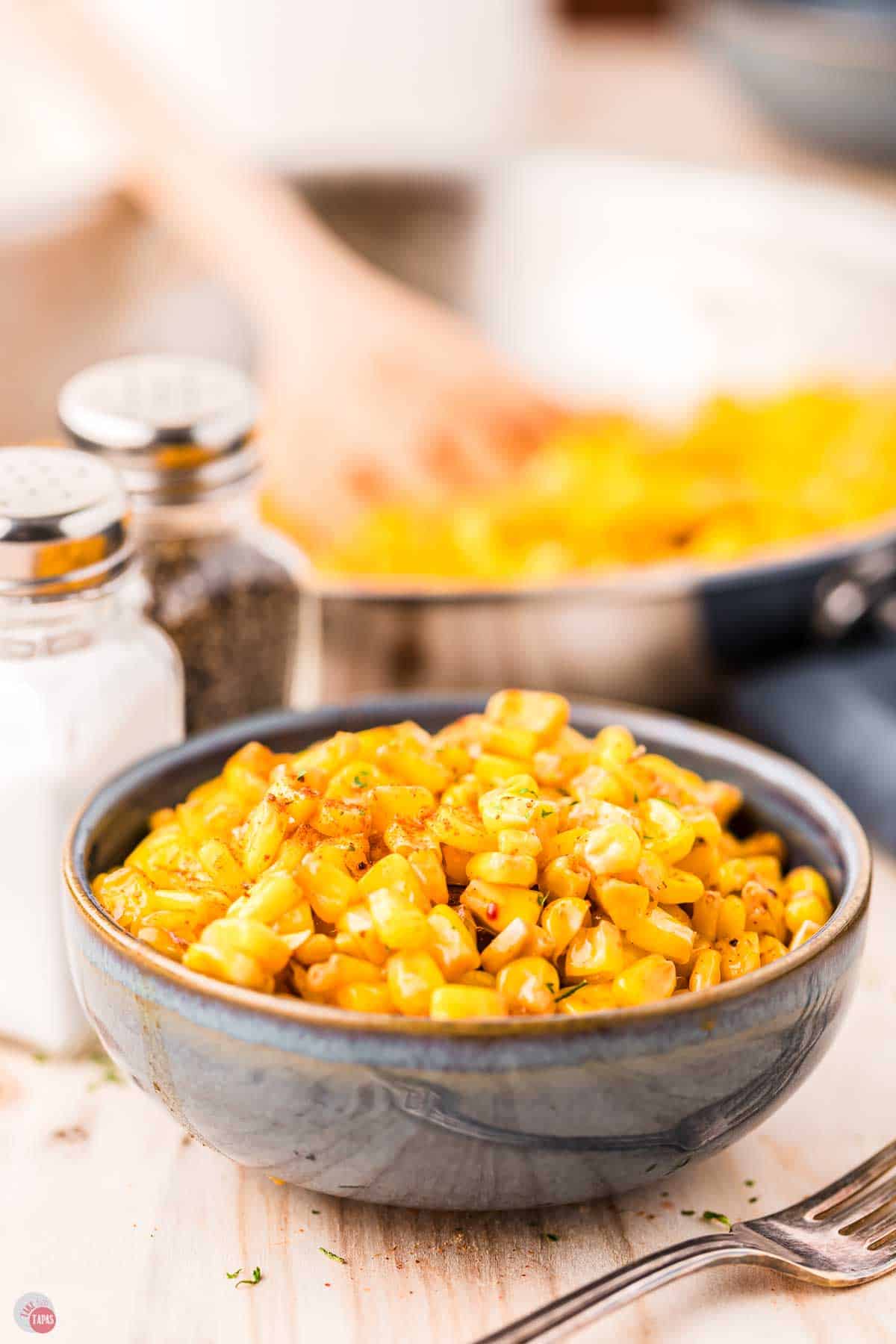 bowl of fried corn in a blue bowl