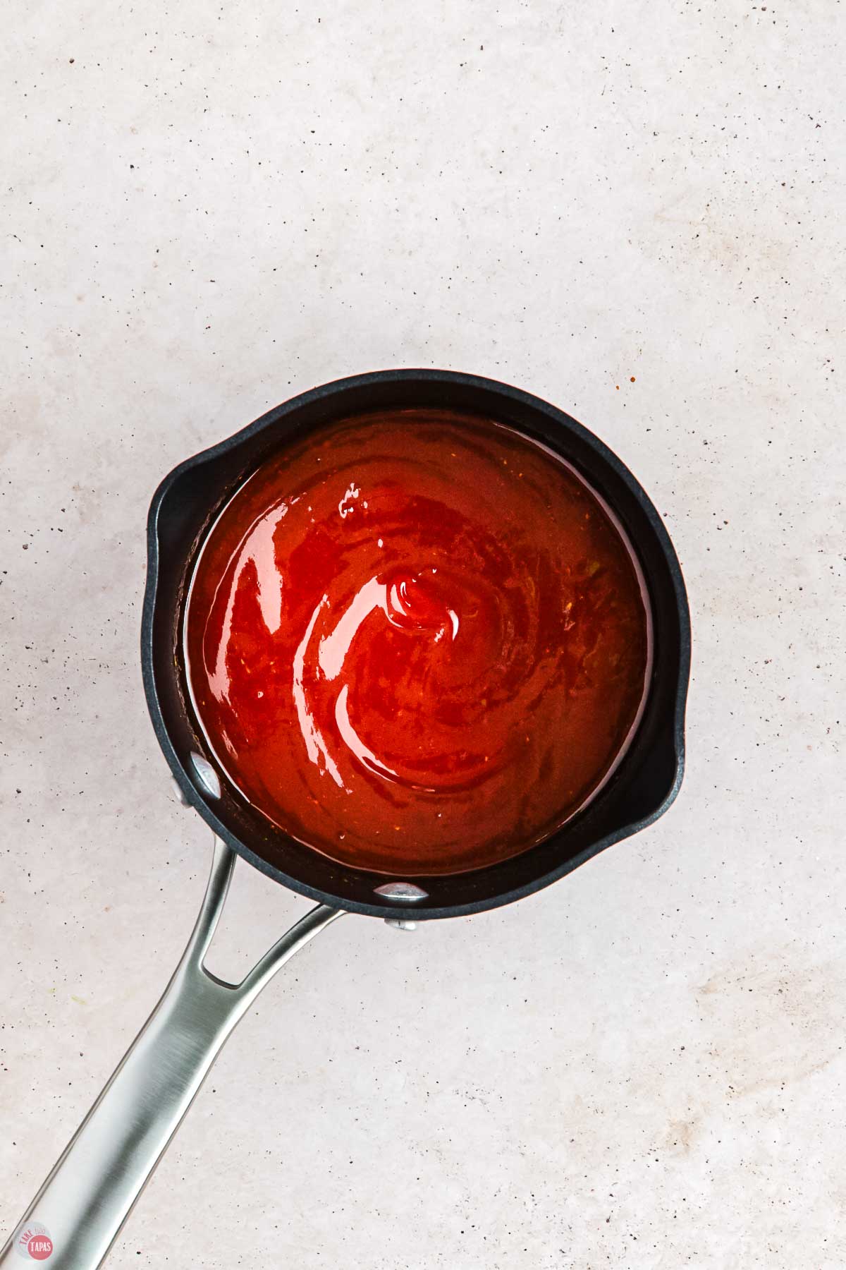 black pot with bbq sauce in it