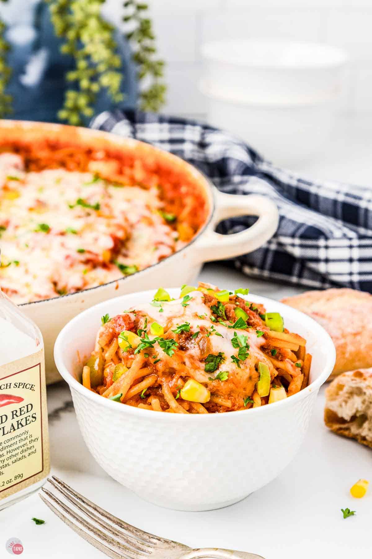 bowl and skillet with a pasta recipe in it