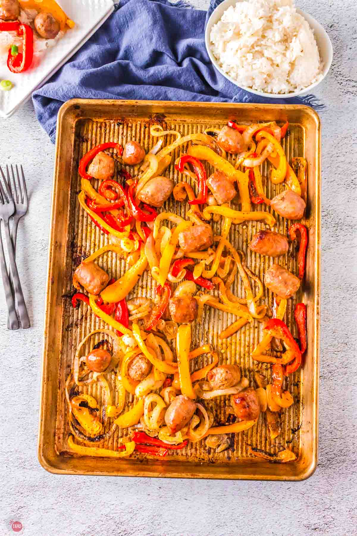 sausage peppers and onions baked on a sheet pan