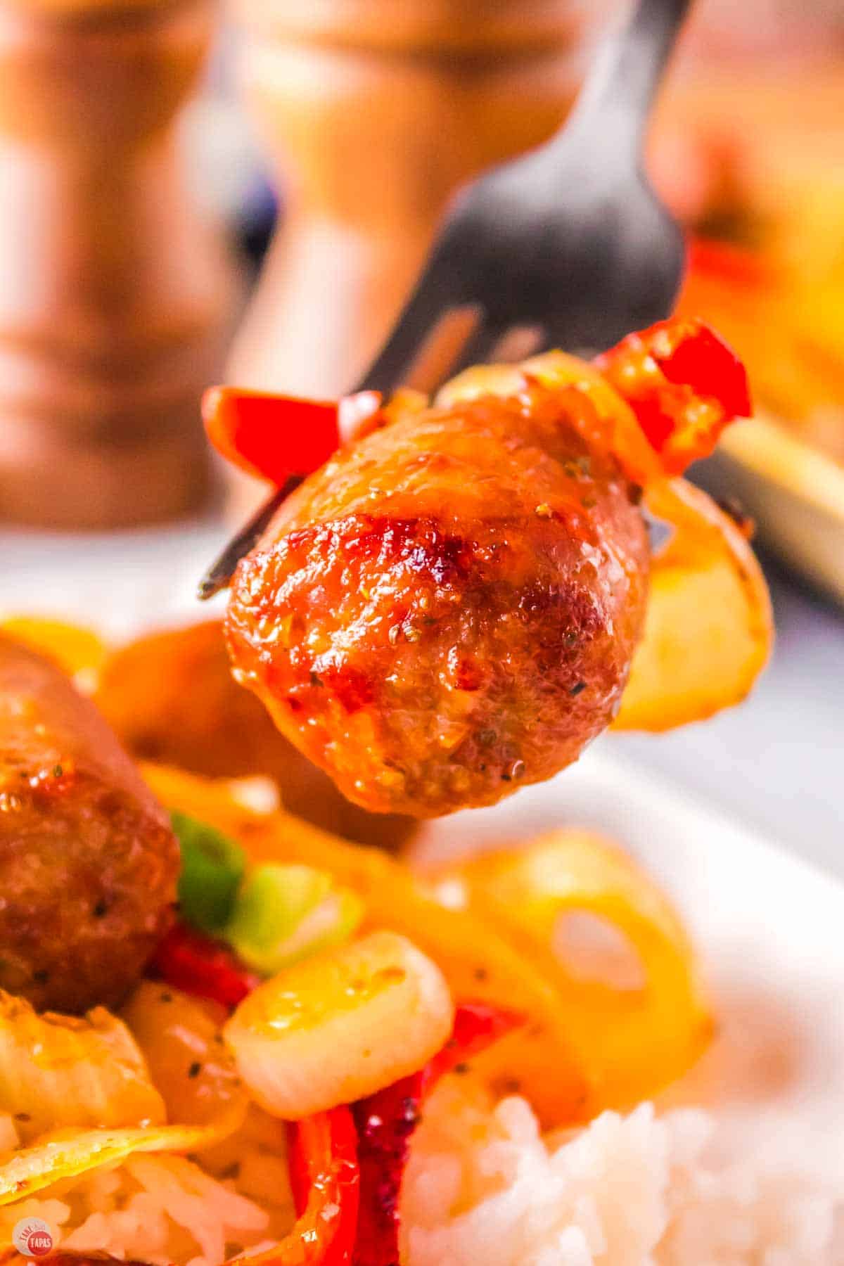 close up of sausage on a fork