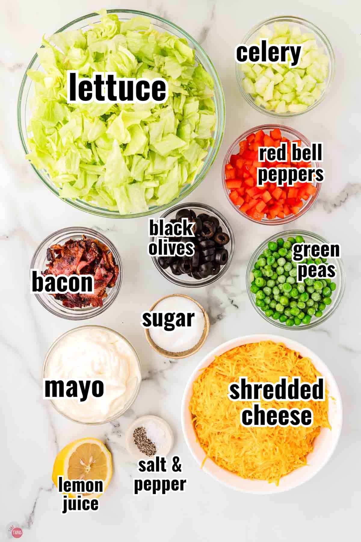 ingredients for a salad recipe in individual bowls with text overlay labeling them