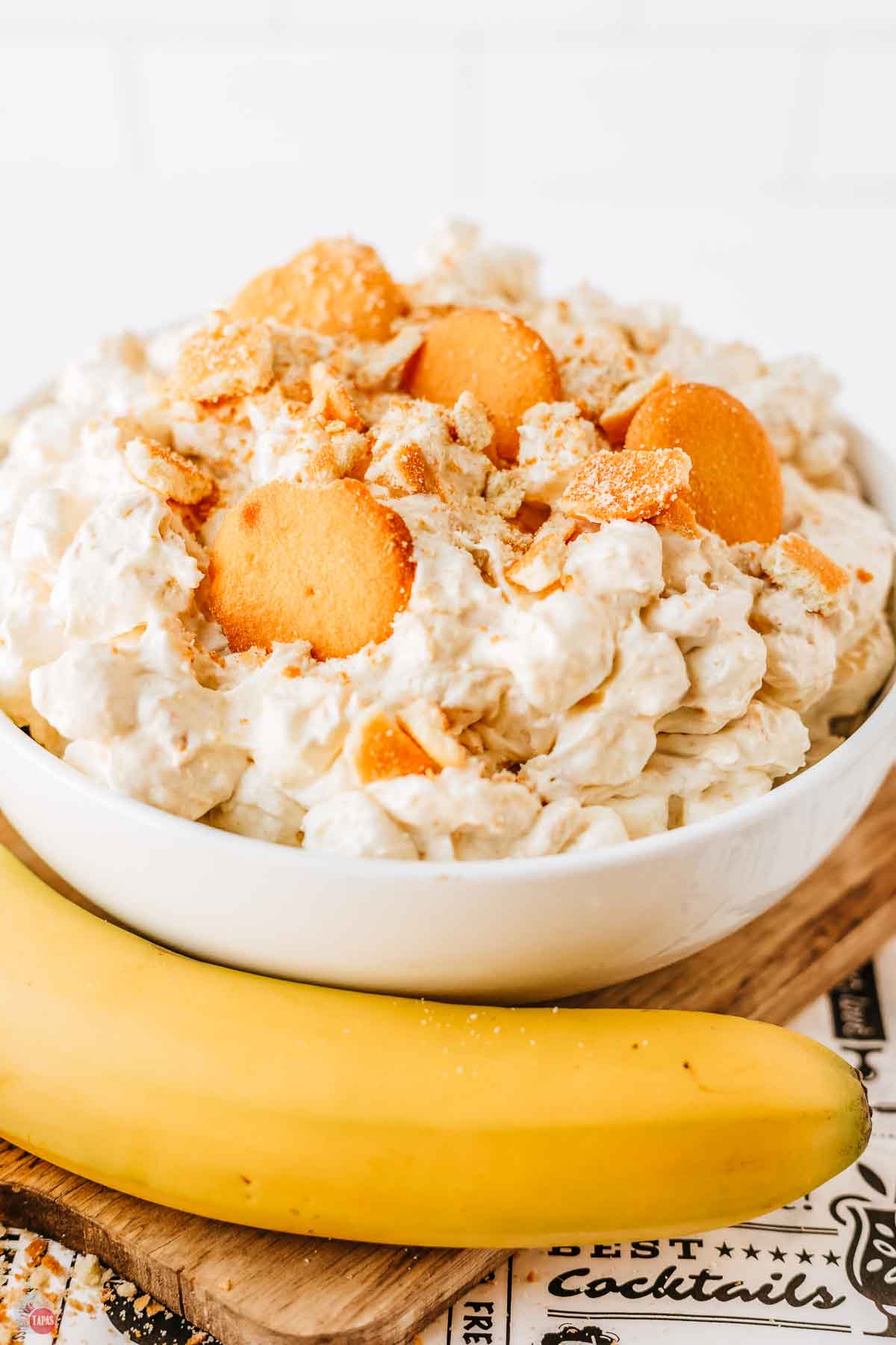 bowl of marshmallow salad with crushed wafers on top