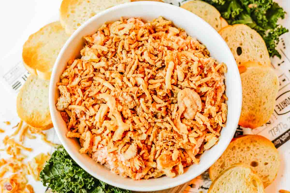 bowl of dip with parsley and toast