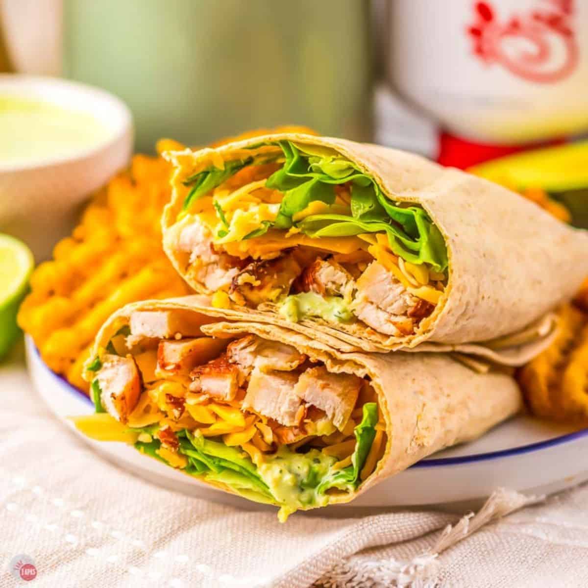 copycat Chick Fil A Cool Wrap on a plate with waffle fries