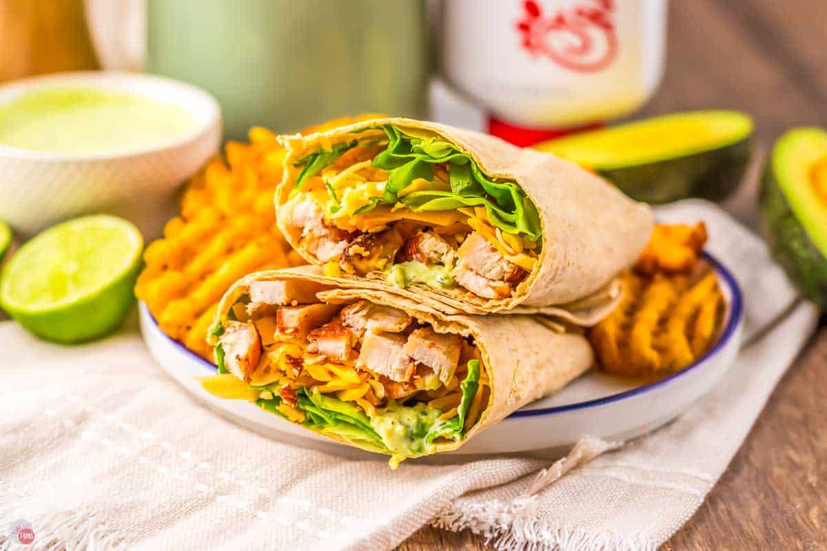 chicken cool wrap sliced in half with fries