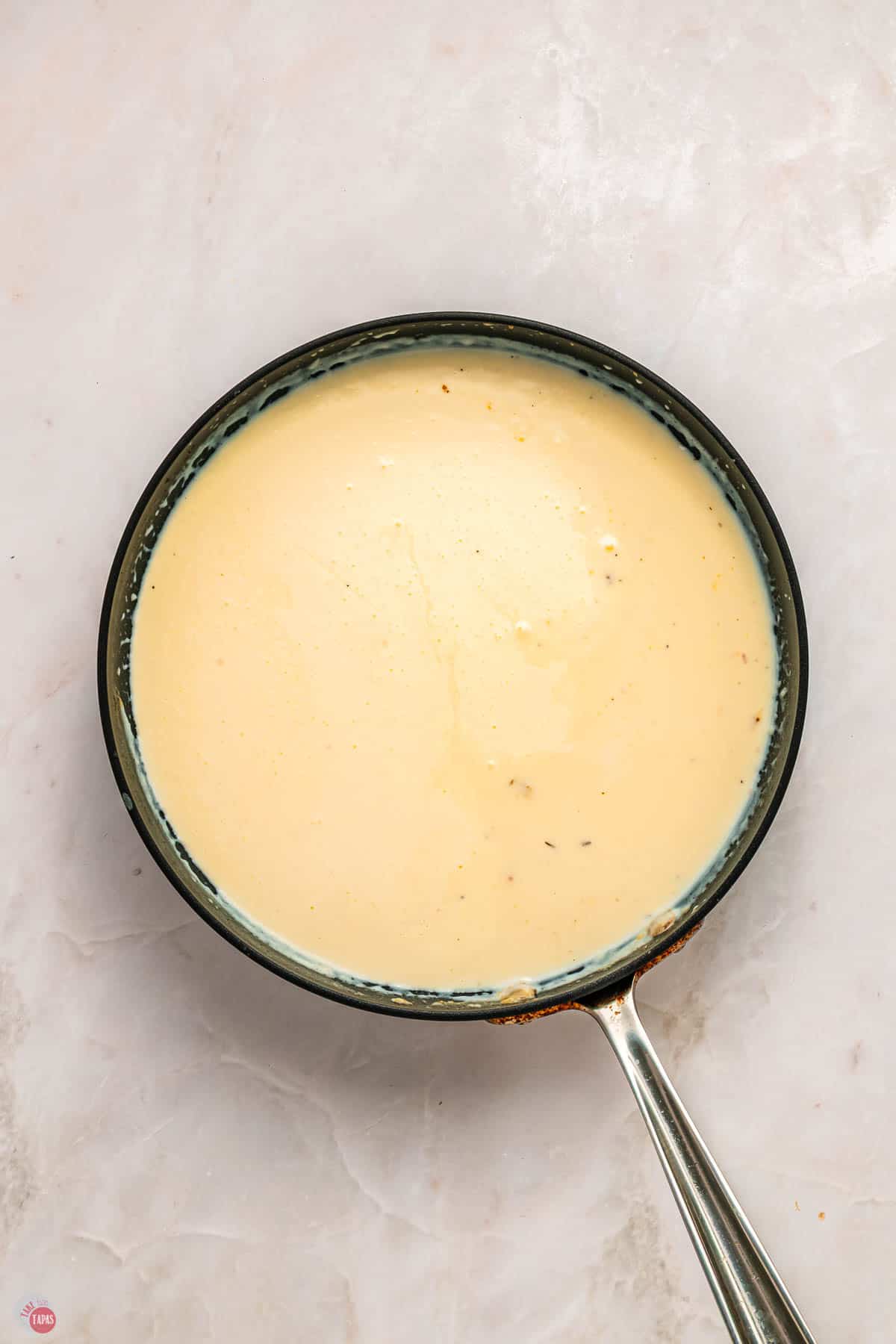 alfredo sauce in a skillet