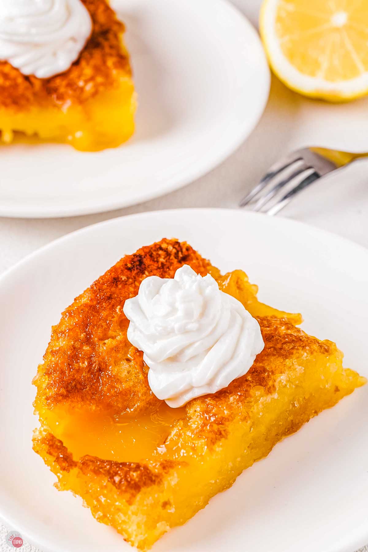 close up of lemon dessert on a white plate
