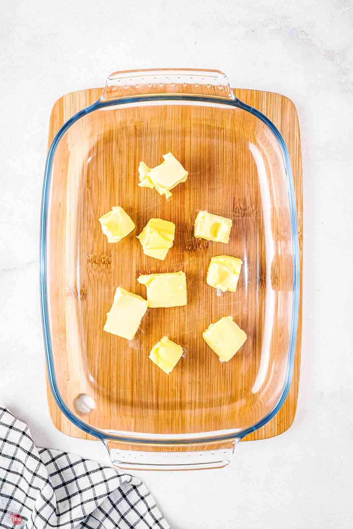 pats of butter in a clear dish