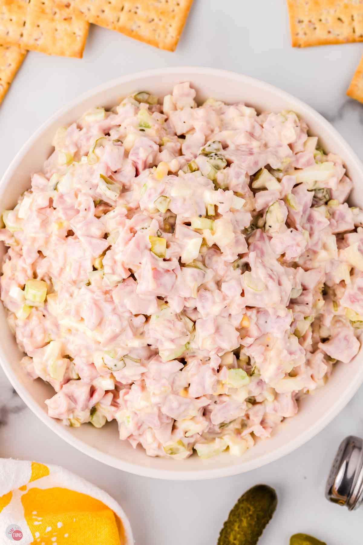 close up of ham salad in a white bowl