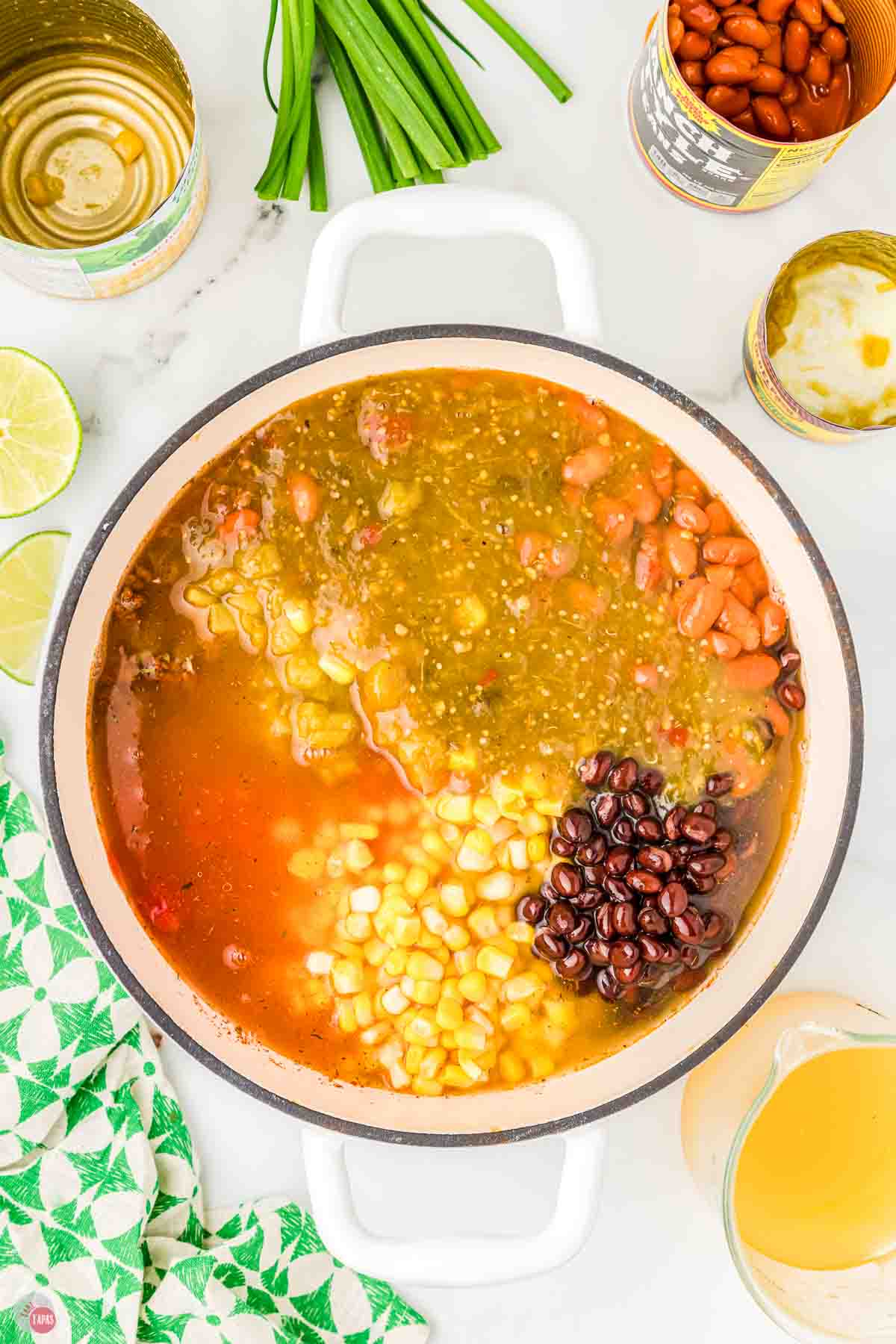 large white pot with soup in it before stirred